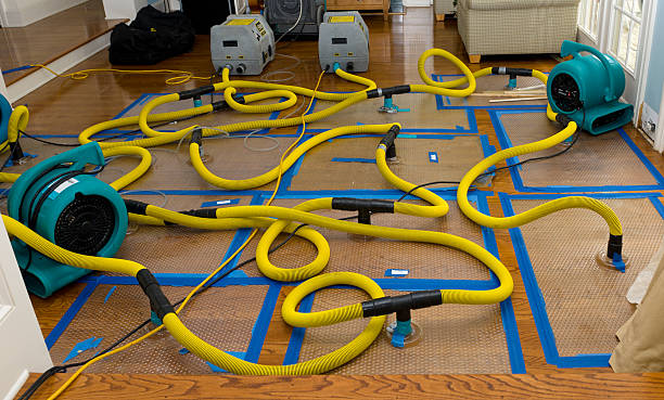 Professional Flood Damage Restoration technician working in Oakwood, PA